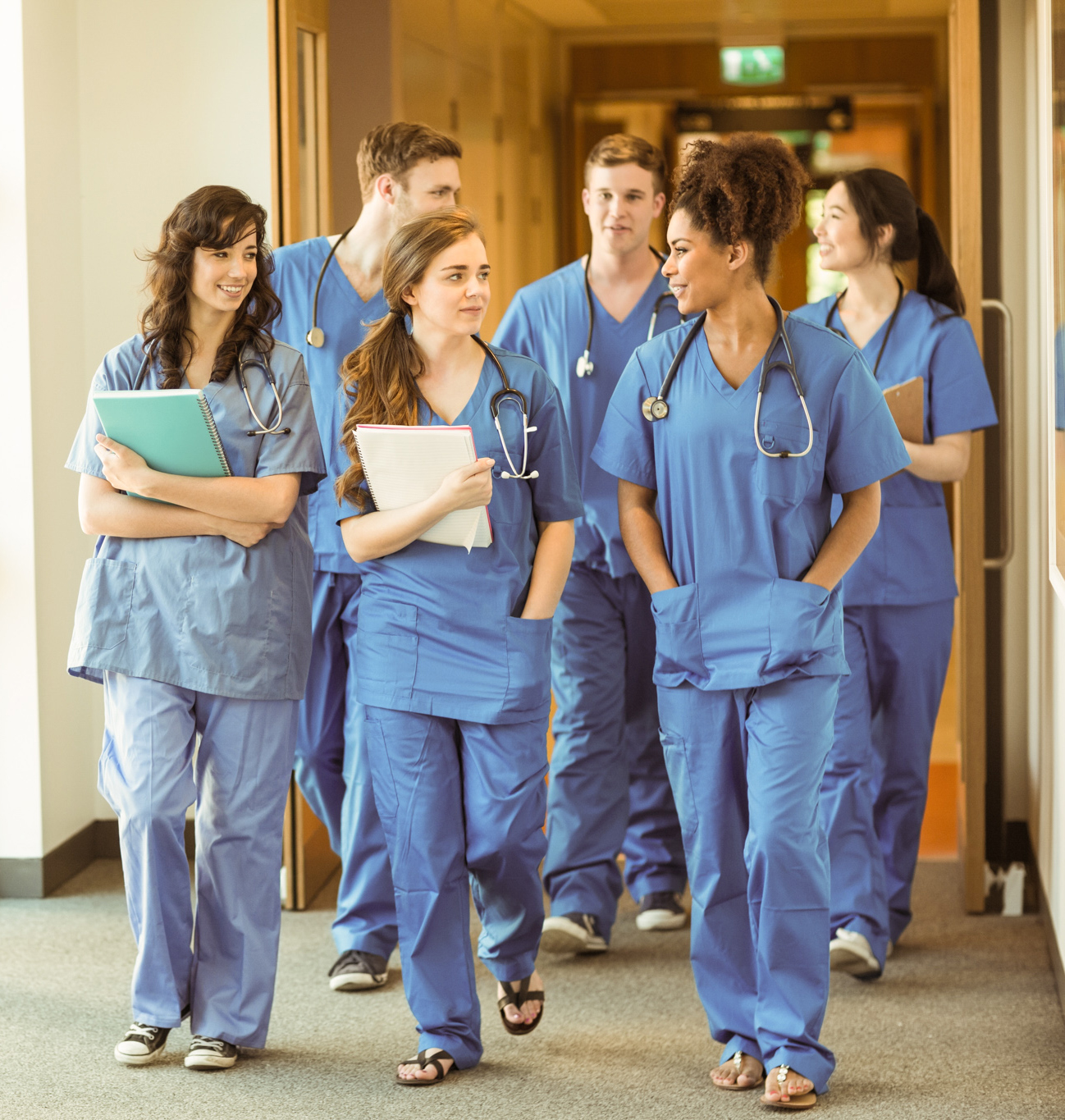 group of medical professionals walking to class